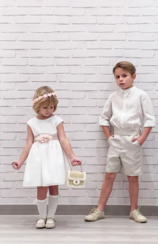 Los pequeños también dejan huella Vestido niña de ceremonia topos rosas con fajín rosa y detalle floral en cintura