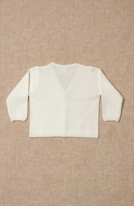 La calidez también se diseña Chaqueta niño ceremonia color crudo, clásica con ochos