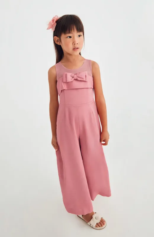 Estilo a la altura del evento Mono niña Lazo Abel and Lula color coral, ideal para ceremonias de niñas mayores y hermanas de Comunión