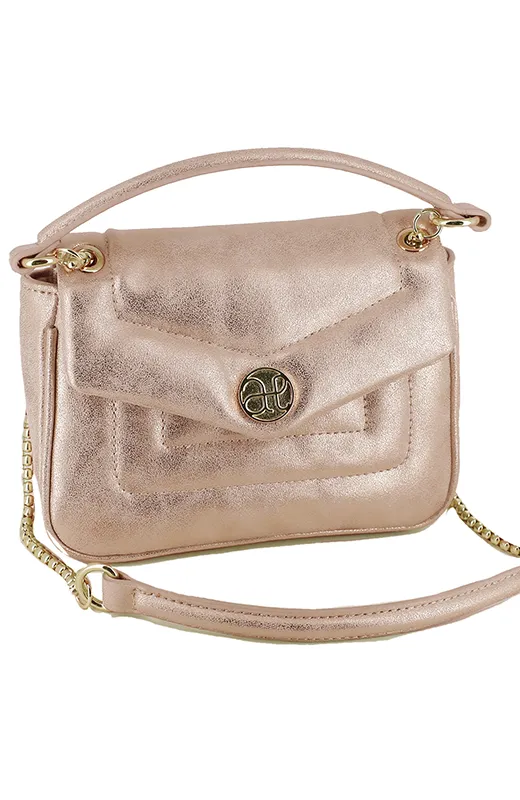 Belleza que acompaña Bolsito niña Abel and Lula rosa metalizado, ideal para adolescentes