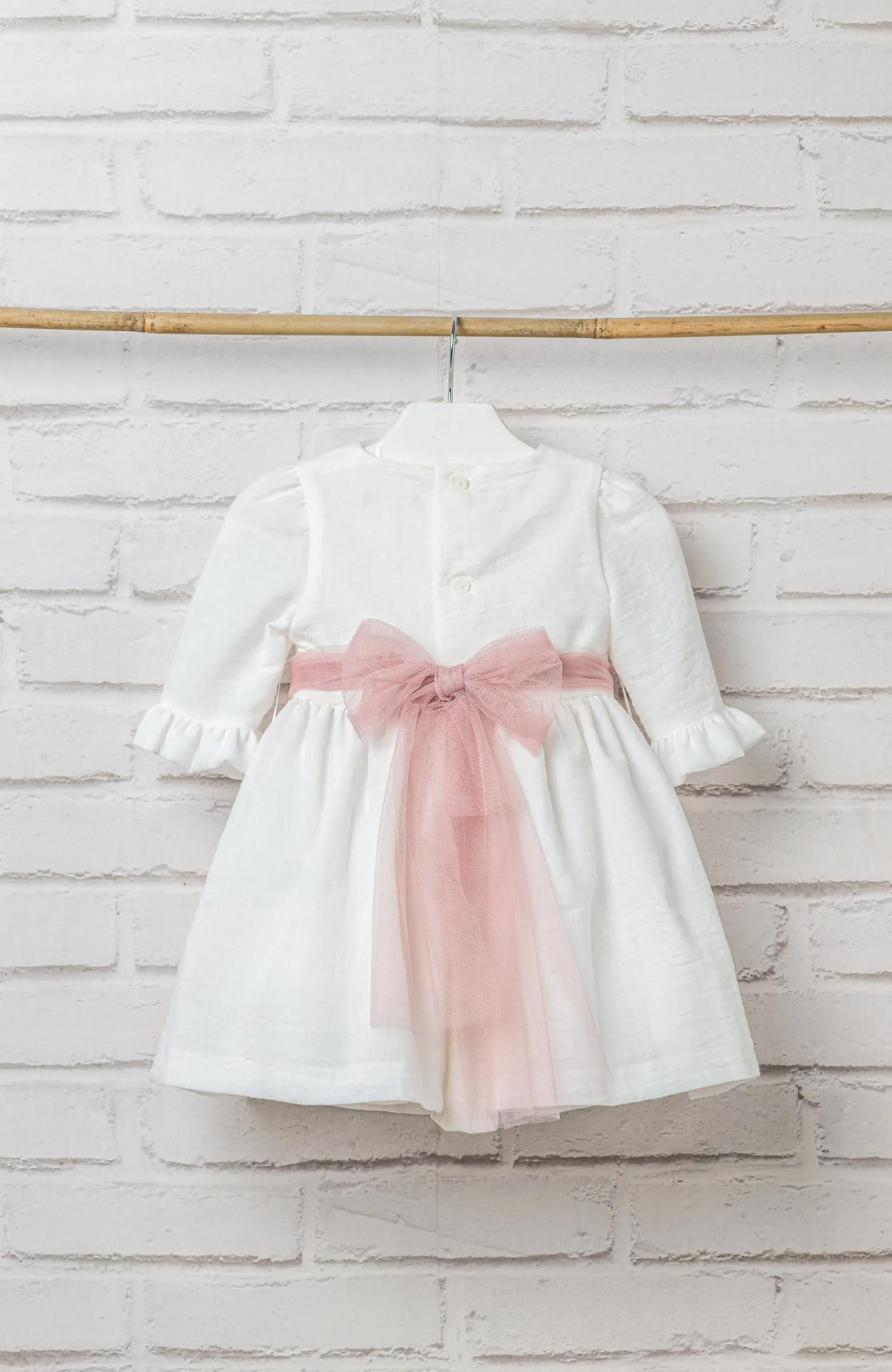 Vestido ceremonia niña bebé manga francesa con lazada rosa ideal para bautizo